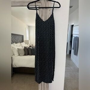 Black and white polkadot slip dress with a side slit